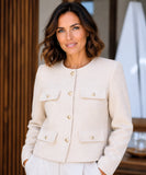 Cream cropped tweed blazer with gold buttons and flap pockets