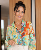 Women's linen shirt with aqua patchwork print, hands at waist