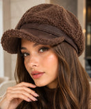 Women's plush sherpa newsboy cap in dark brown with a suede brim, side view