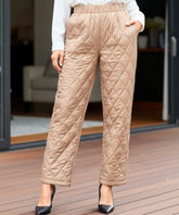 Women's quilted thermal pants in camel, close-up