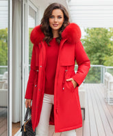 Woman wearing a long parka coat in red