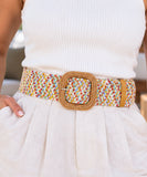 Women's boho belt with pastel woven elastic band and square buckle on a white outfit