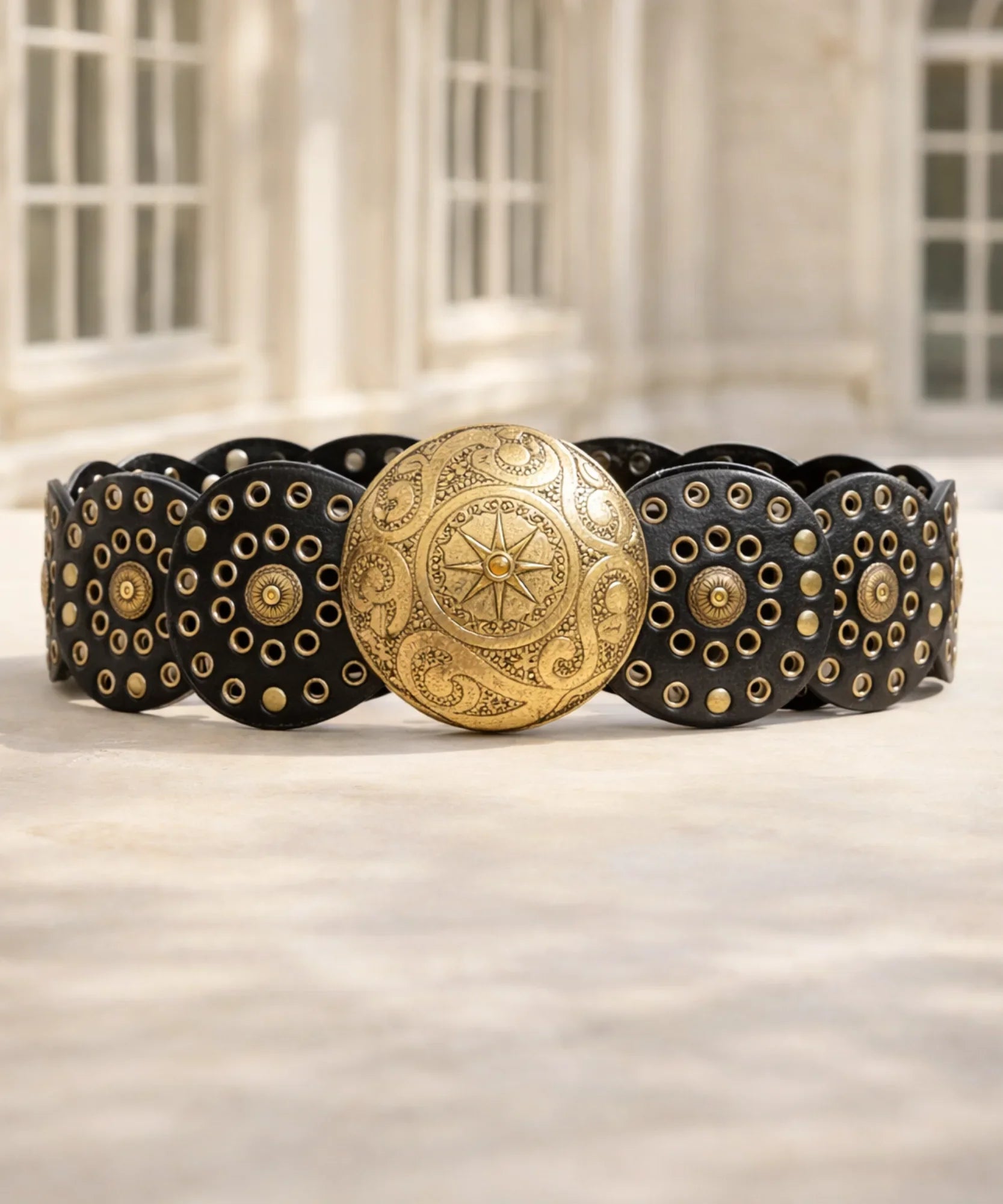 Women's black concho belt with engraved gold buckle and studded medallions