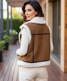 Women's leather moto vest in brown with ivory shearling collar, close-up detail