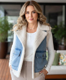 Women's sherpa-lined denim vest in blue, front view with sherpa collar