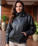 Woman wearing an asymmetrical leather jacket in black
