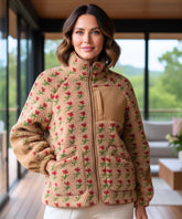 Woman wearing an oversized floral fleece jacket in camel