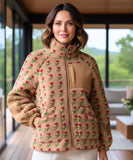 Woman wearing an oversized floral fleece jacket in camel