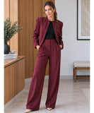 Women's burgundy blazer worn open over a black top