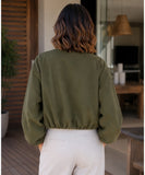 Close-up of the olive green wool bomber jacket and balloon sleeve