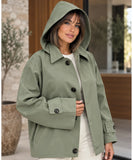 Women's utility jacket in olive green worn with the hood up