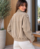 Women's oversized suede bomber jacket in beige, back view with elastic hem
