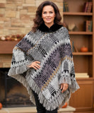 Women's boho poncho sweater in black and grey chunky knit with fur-trim collar, front view