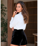 Women's high waisted black velvet shorts styled look