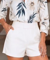 Women's white high waisted dress shorts front view