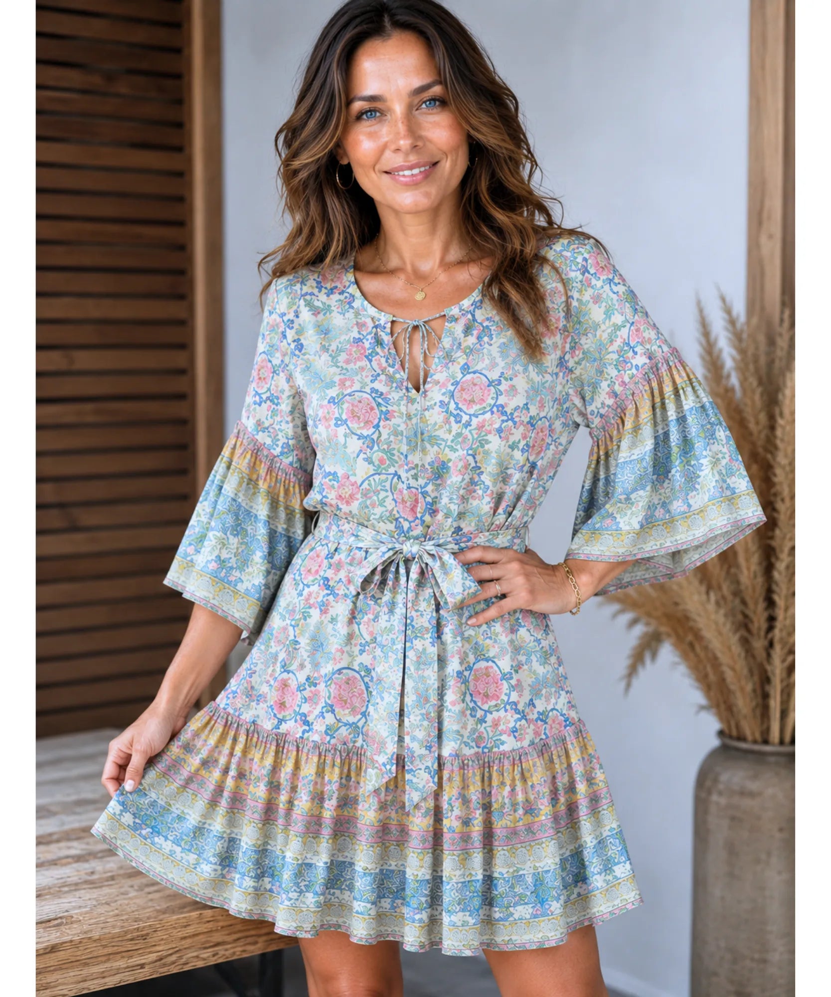 Blue boho floral mini dress with bell sleeves, front view