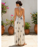 Women's boho halter maxi dress in white print, side view