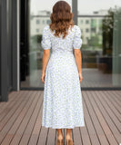 Women's floral wrap midi dress in blue floral print, back view