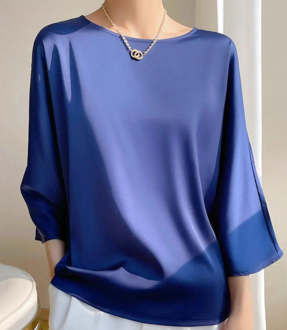 Blusa Social Feminina em Cetim com Manga Ampla, ideal para ambiente formal e eventos, oferecendo estilo e elegância com conforto.