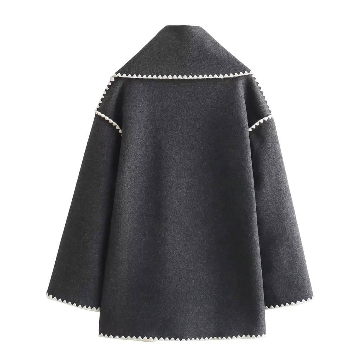 Detail of the contrast stitching on the charcoal wool coat