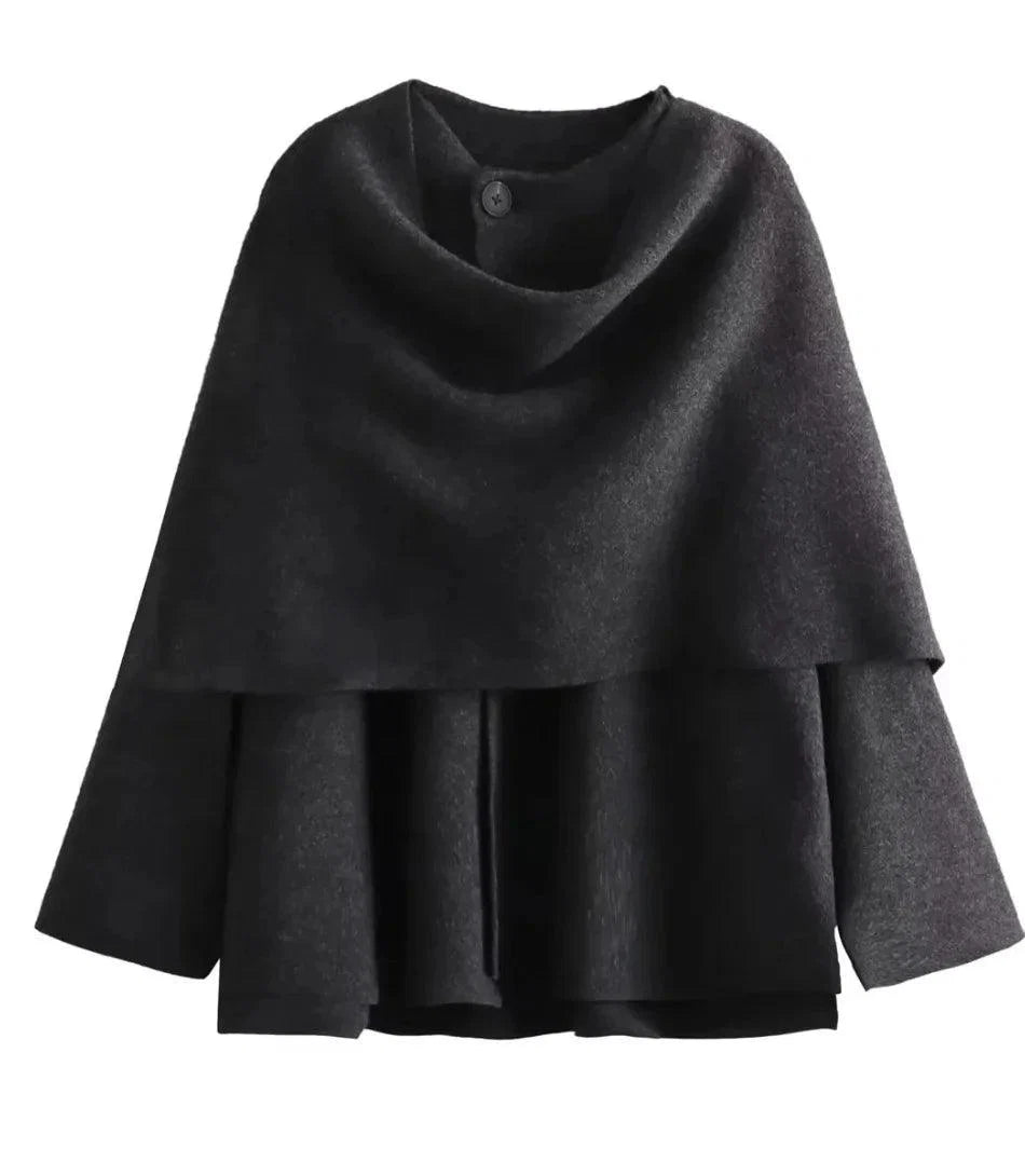 Woman styling the charcoal wool wrap coat outdoors