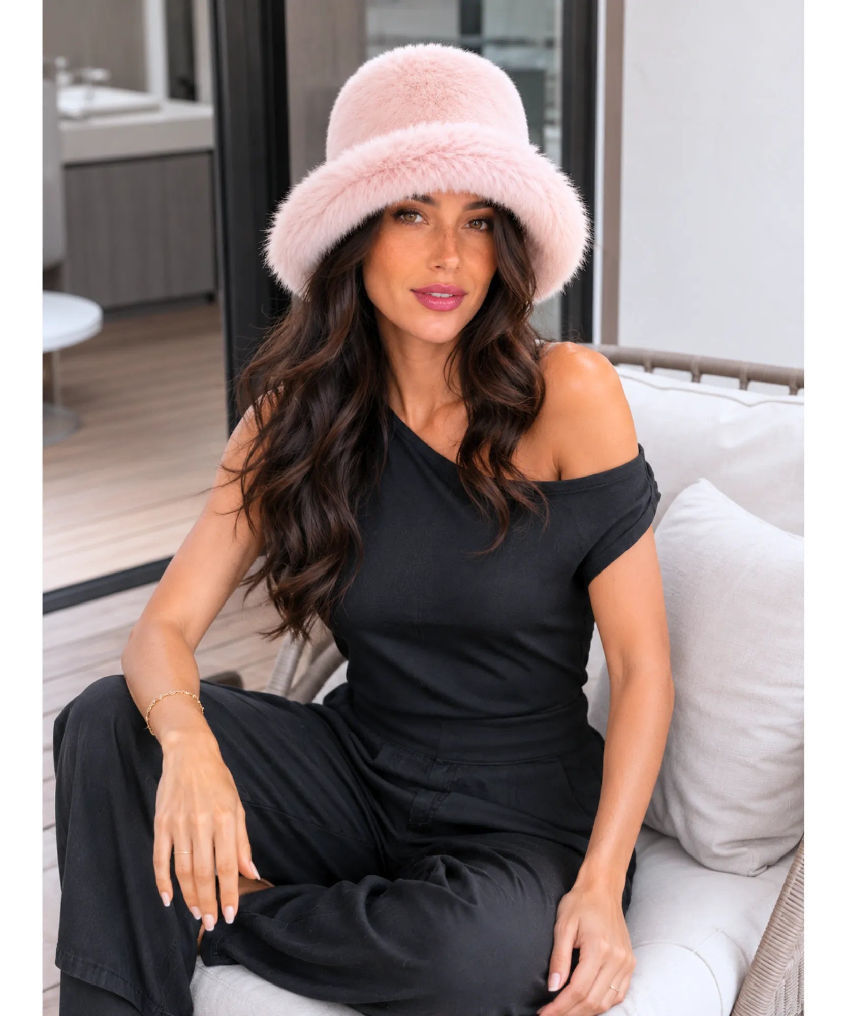 Fur bucket hat with a structured brim, styled for a winter outfit