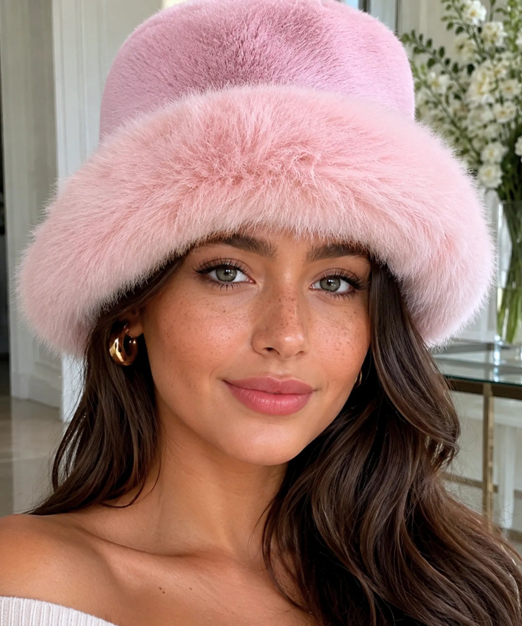 Woman wearing a Blush Pink fur bucket hat with a structured brim