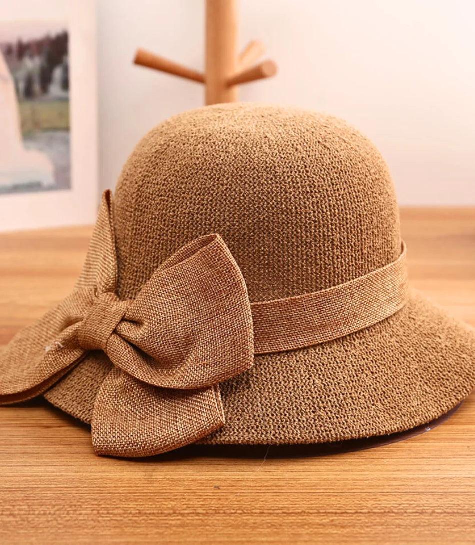 Straw sun hat with a large bow and a wide brim, alternate view