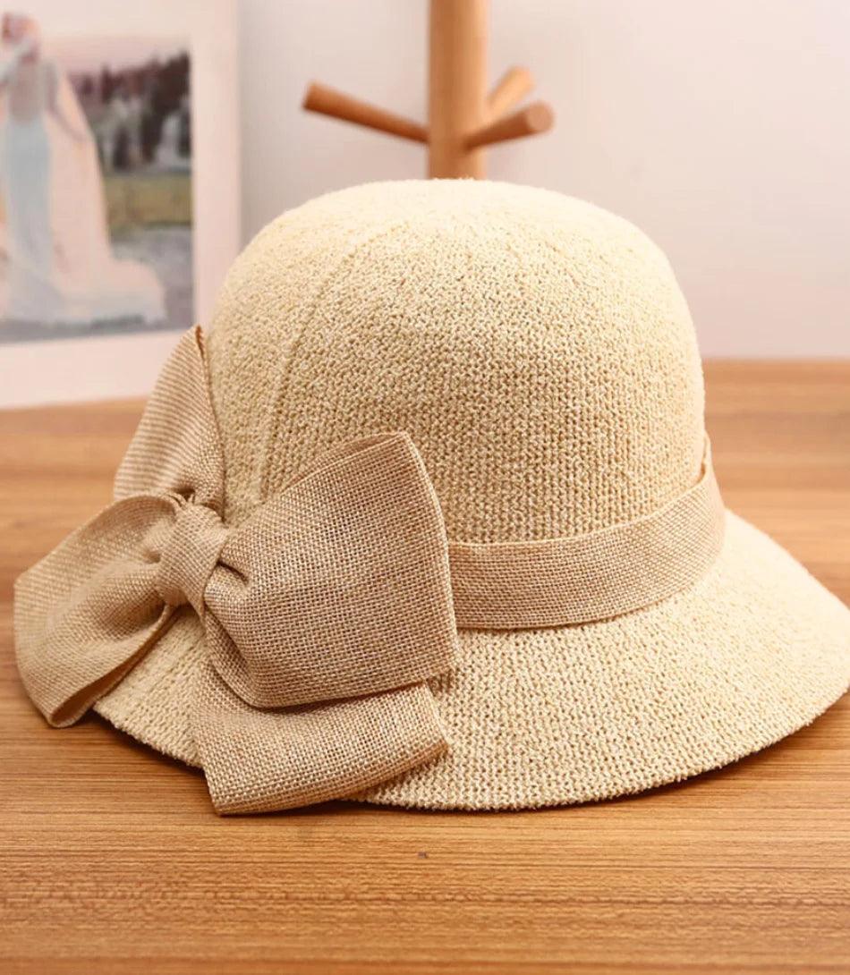 Straw sun hat with a large bow and a wide brim