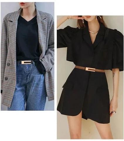 Women's skinny belt with gold buckle worn over a black dress