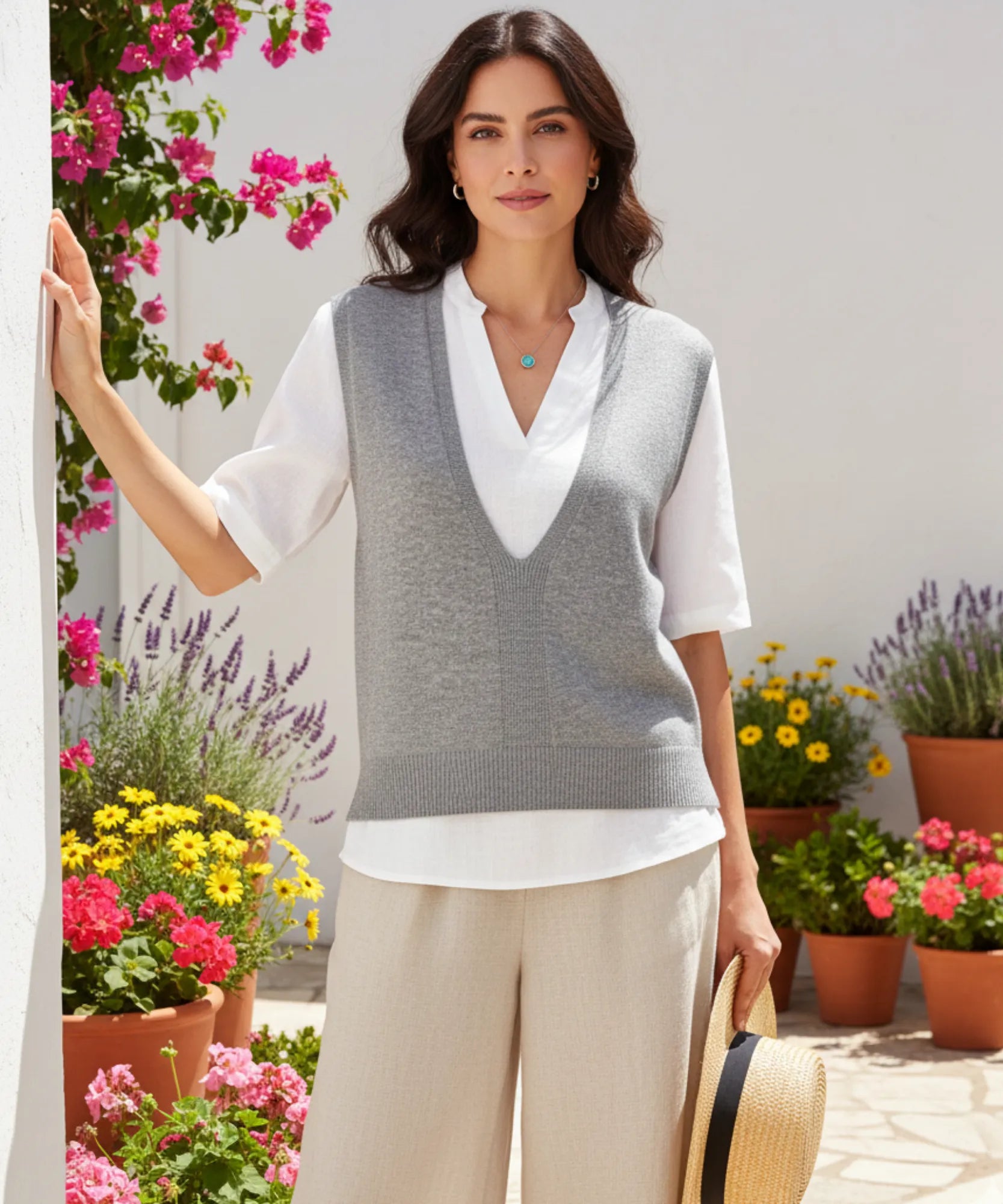Women's oversized V-neck sweater vest in silver gray, styled with a white shirt
