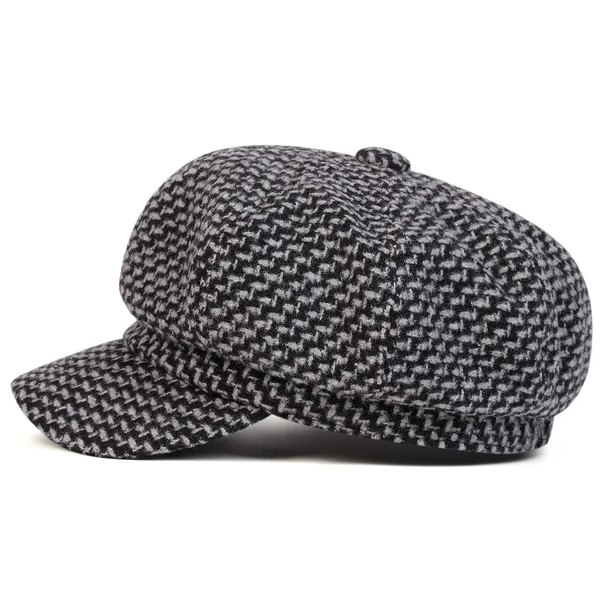 Close-up detail of the houndstooth tweed weave on the newsboy cap