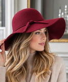Woman wearing a Burgundy wide-brim wool felt fedora hat