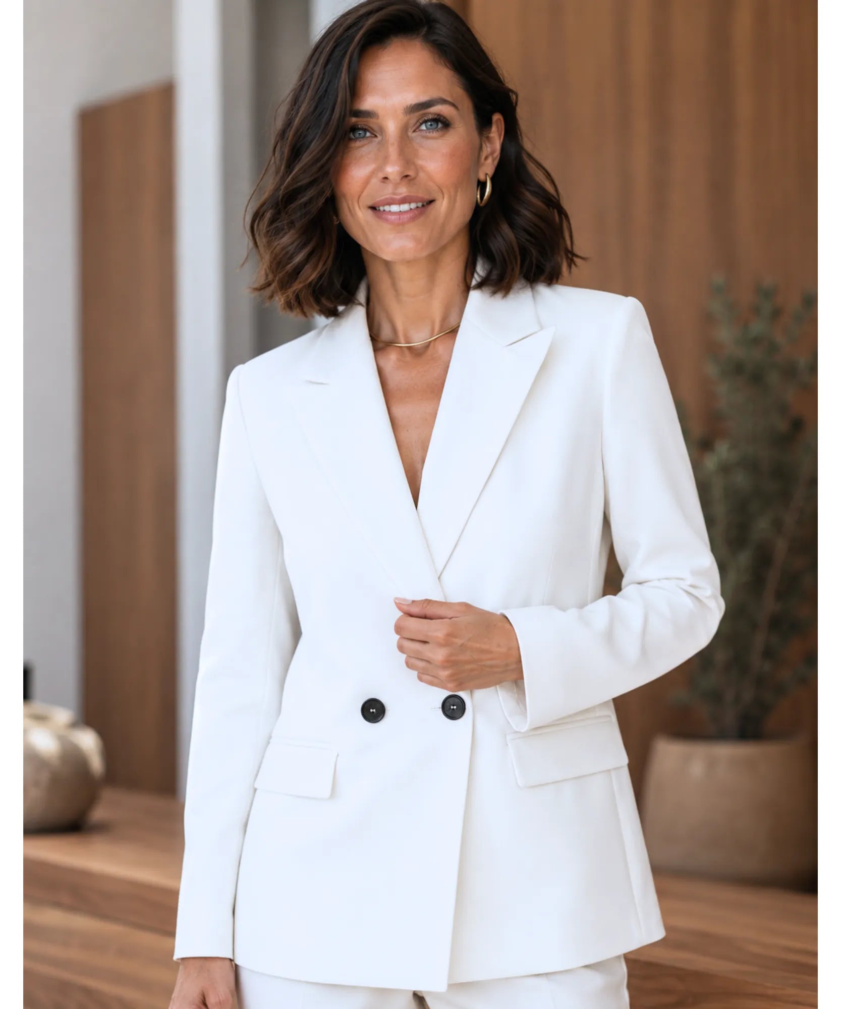 Women's white double breasted blazer, styled front view with buttons closed