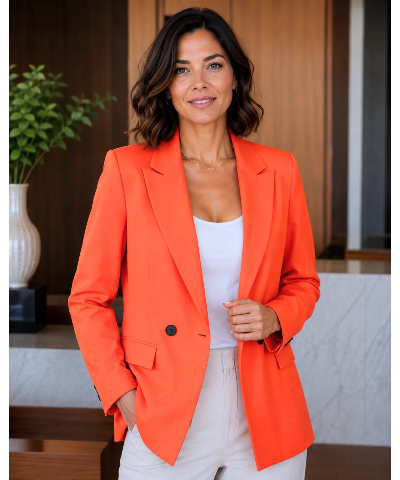 Women's orange tailored double breasted blazer, front view