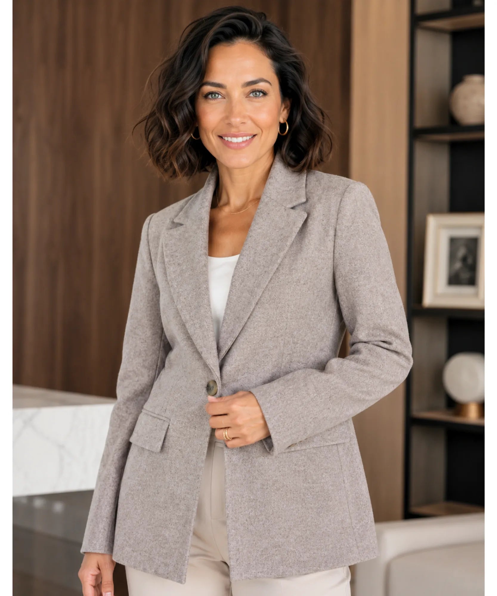 Beige structured blazer with a one button closure