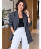 Charcoal pinstripe oversized blazer with ivory wide leg pants and a black top