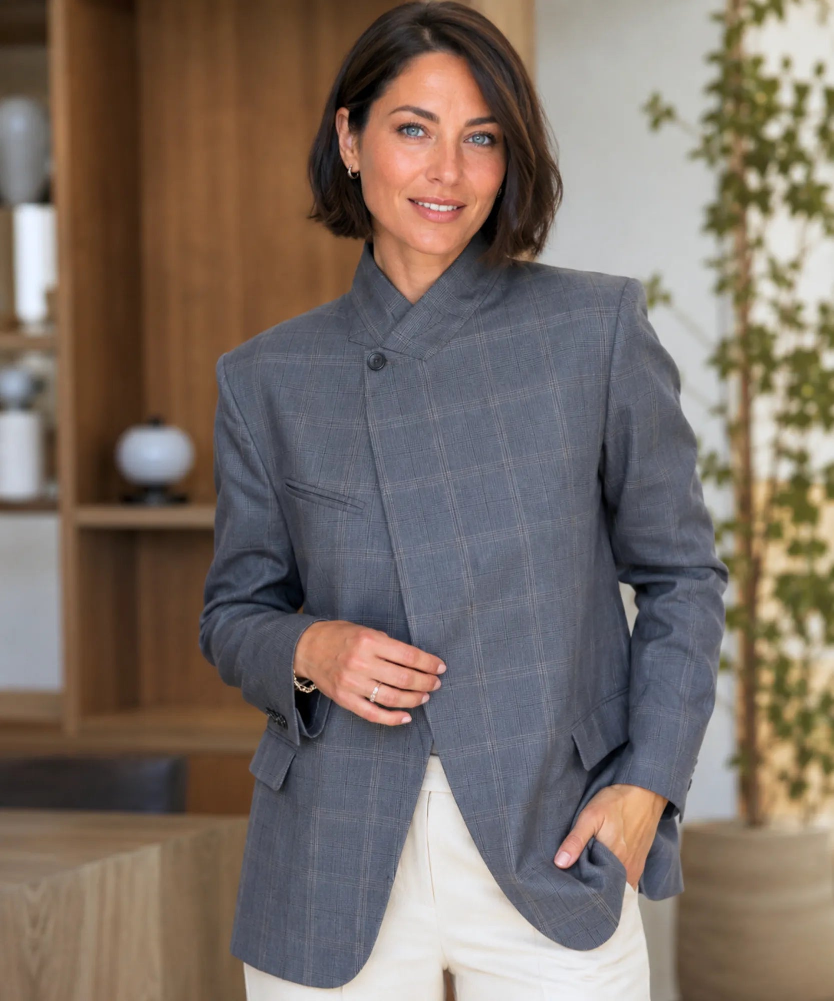 Women's grey plaid blazer with single button and flap pockets