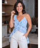 Sky blue floral asymmetrical ruffle top styled with ivory trousers
