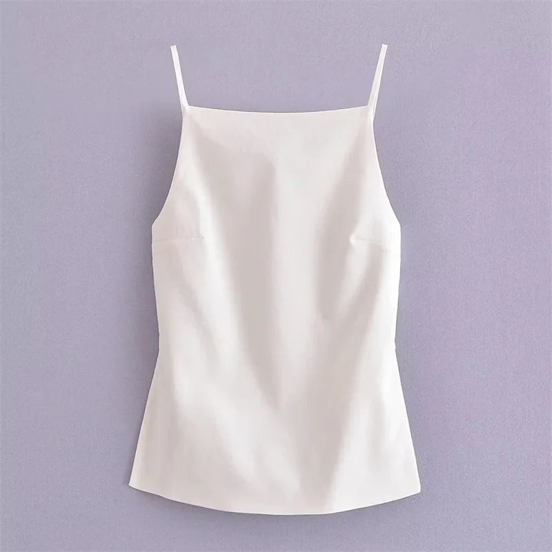 Flat lay of white square neck top with thin adjustable straps