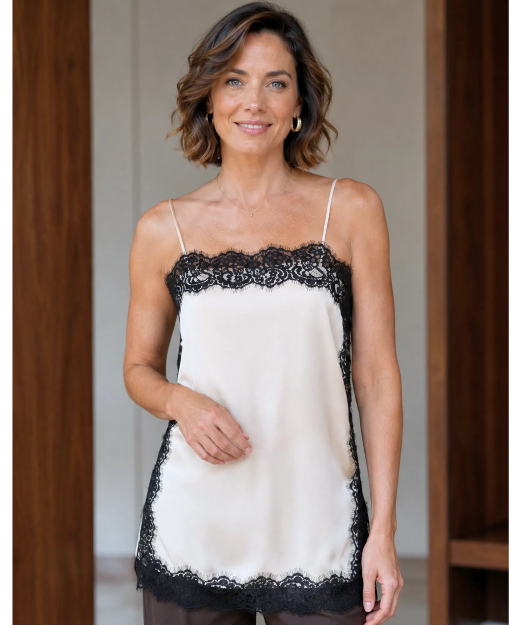 Ivory satin cami top with black lace trim, front view