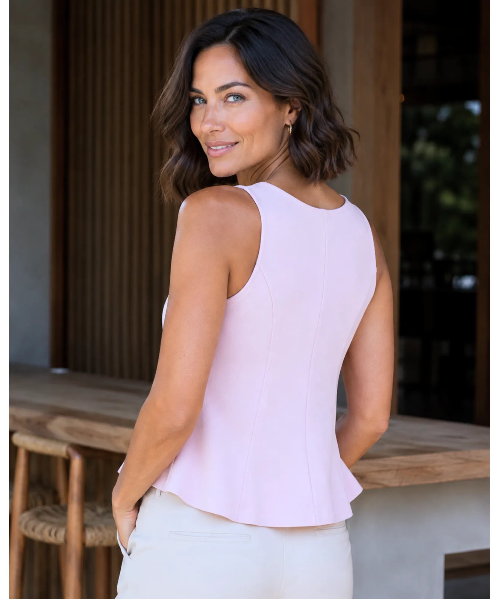 Light pink peplum tank top back view with waist seams