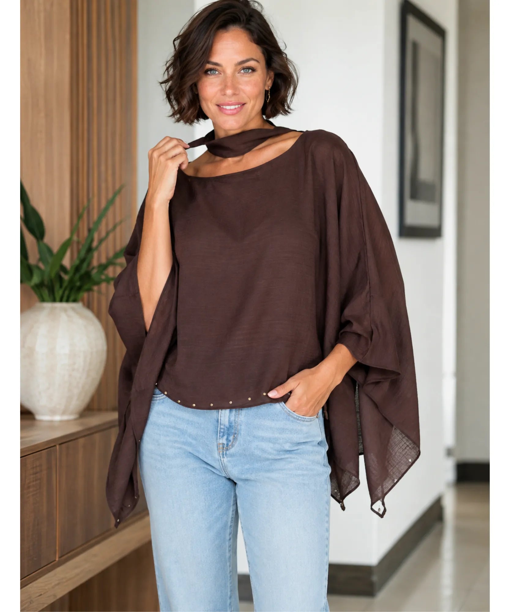 Dark brown sheer cape top with scarf collar, styled view