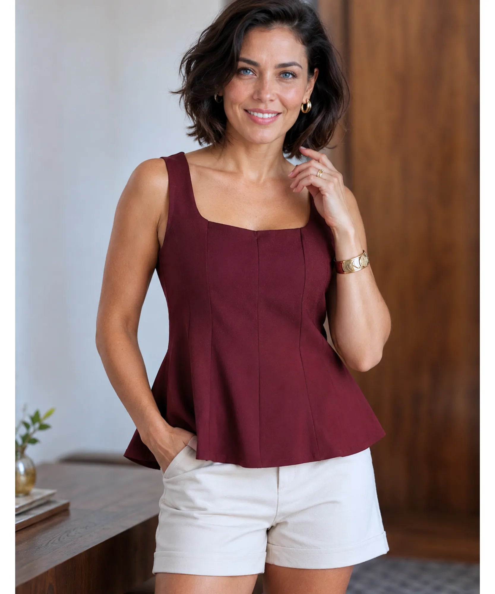 Burgundy square neck peplum tank top styled with ivory shorts