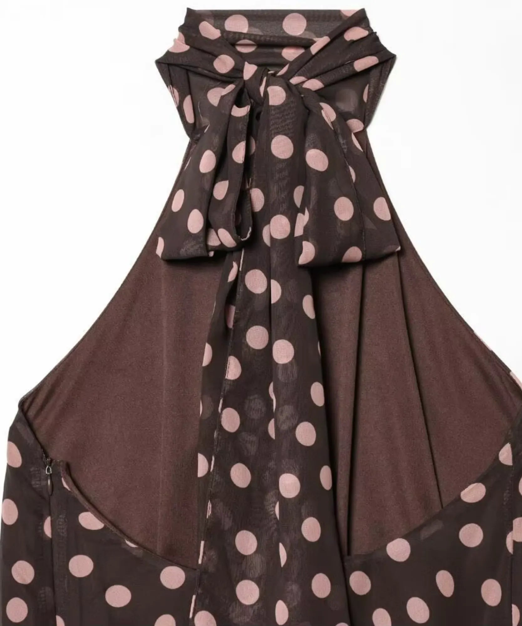 Close-up of the tie neck detail on a brown polka dot halter top