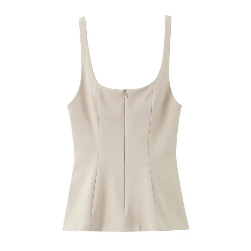 Ivory zip front peplum top flat lay showing the scoop neckline and wide straps