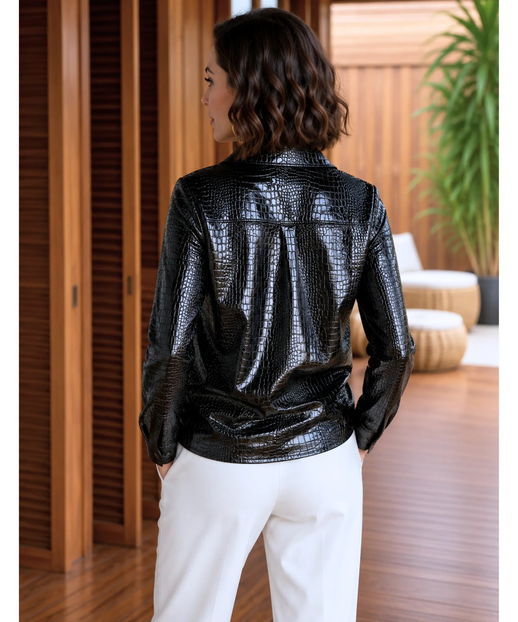 Close-up of the croc-embossed texture on the black leather blouse