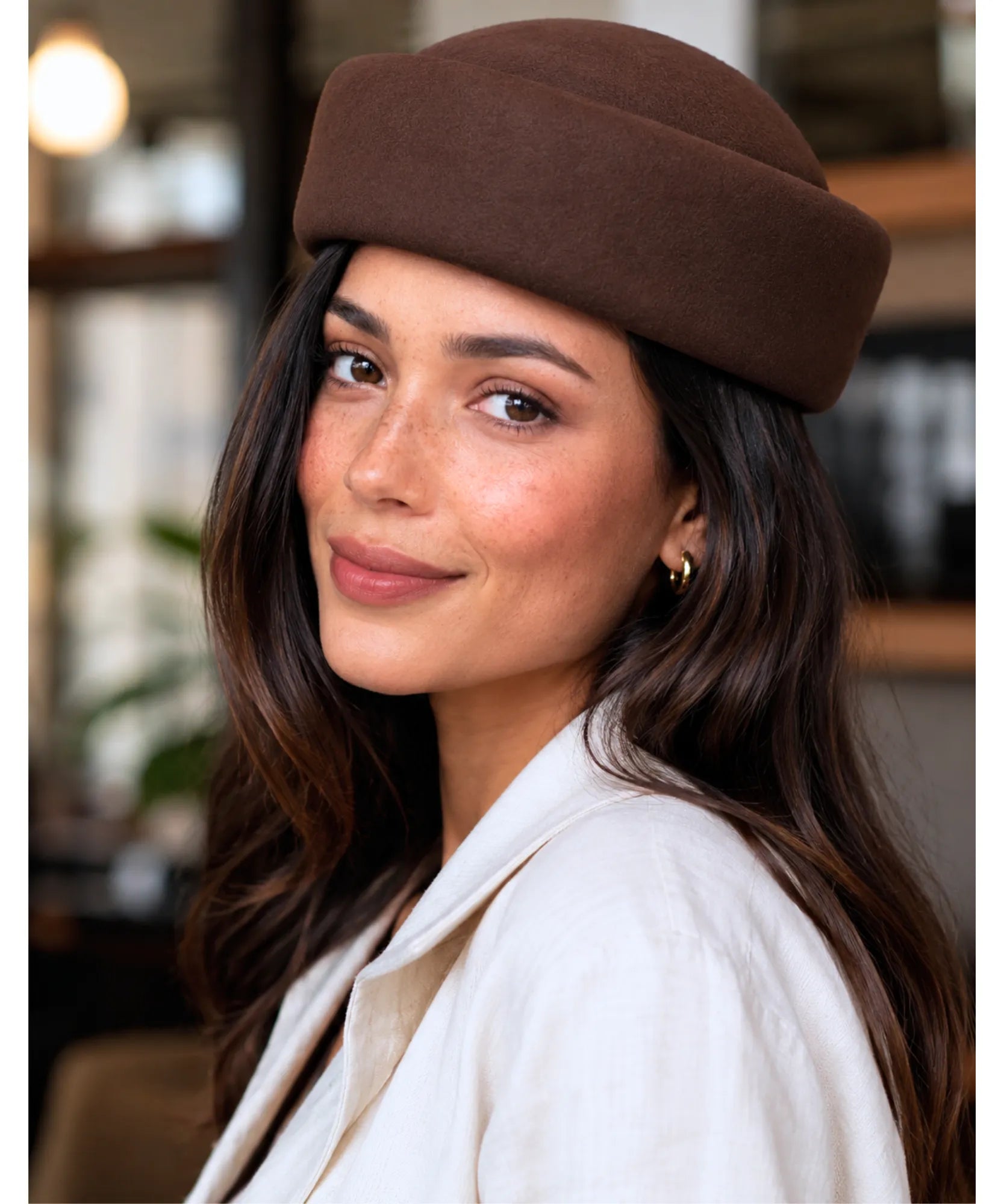 Side view of the dark brown wool pillbox hat
