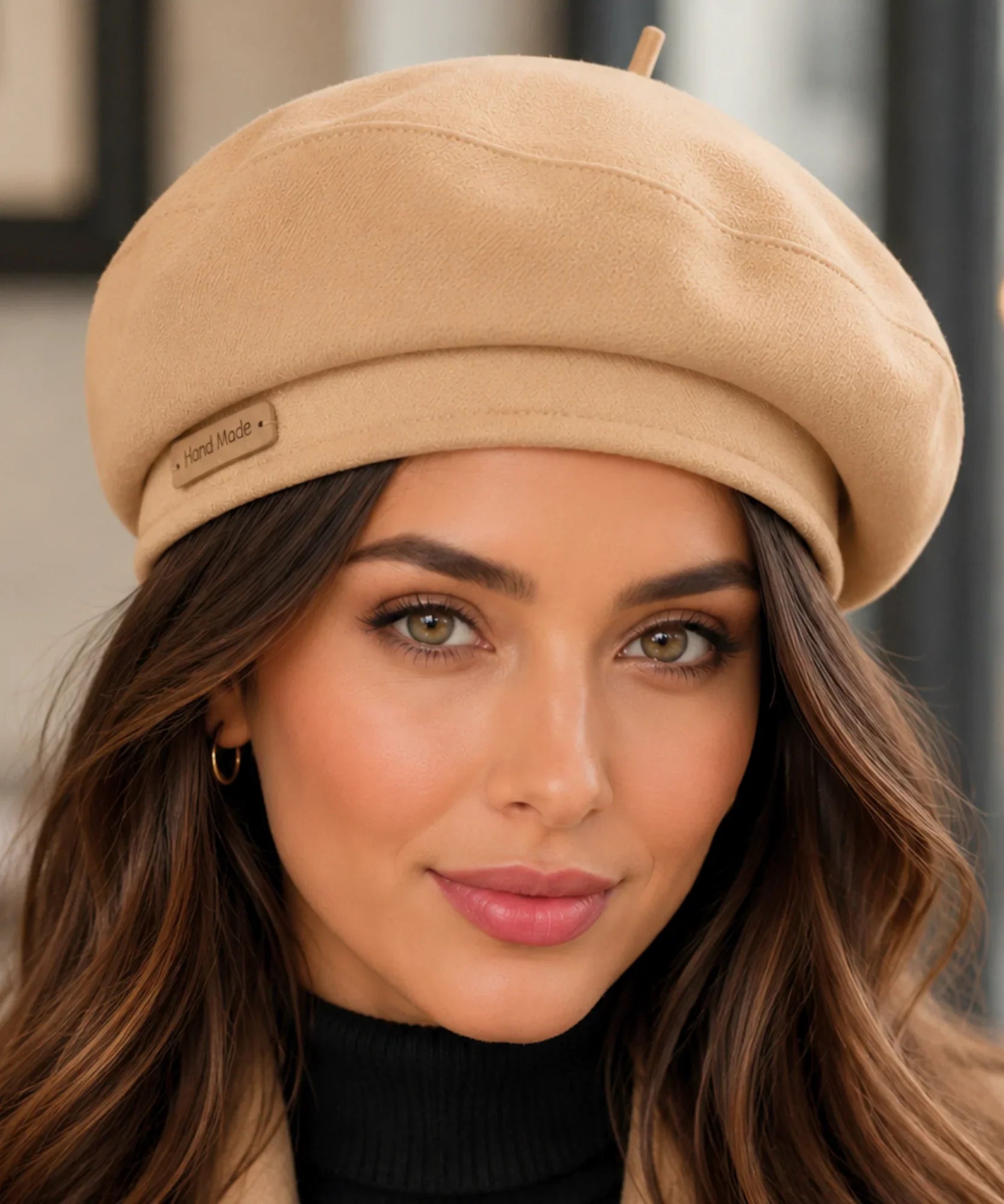 Woman wearing a camel structured twill French beret with a top stem