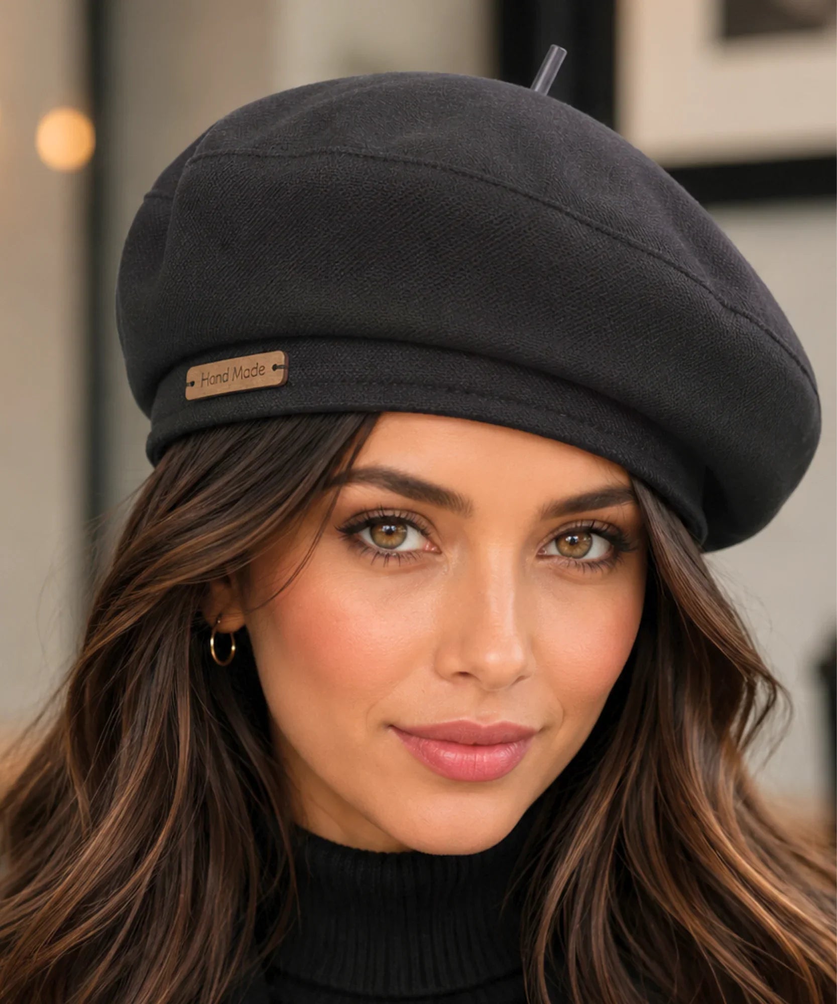 Woman wearing a black structured twill French beret with a top stem